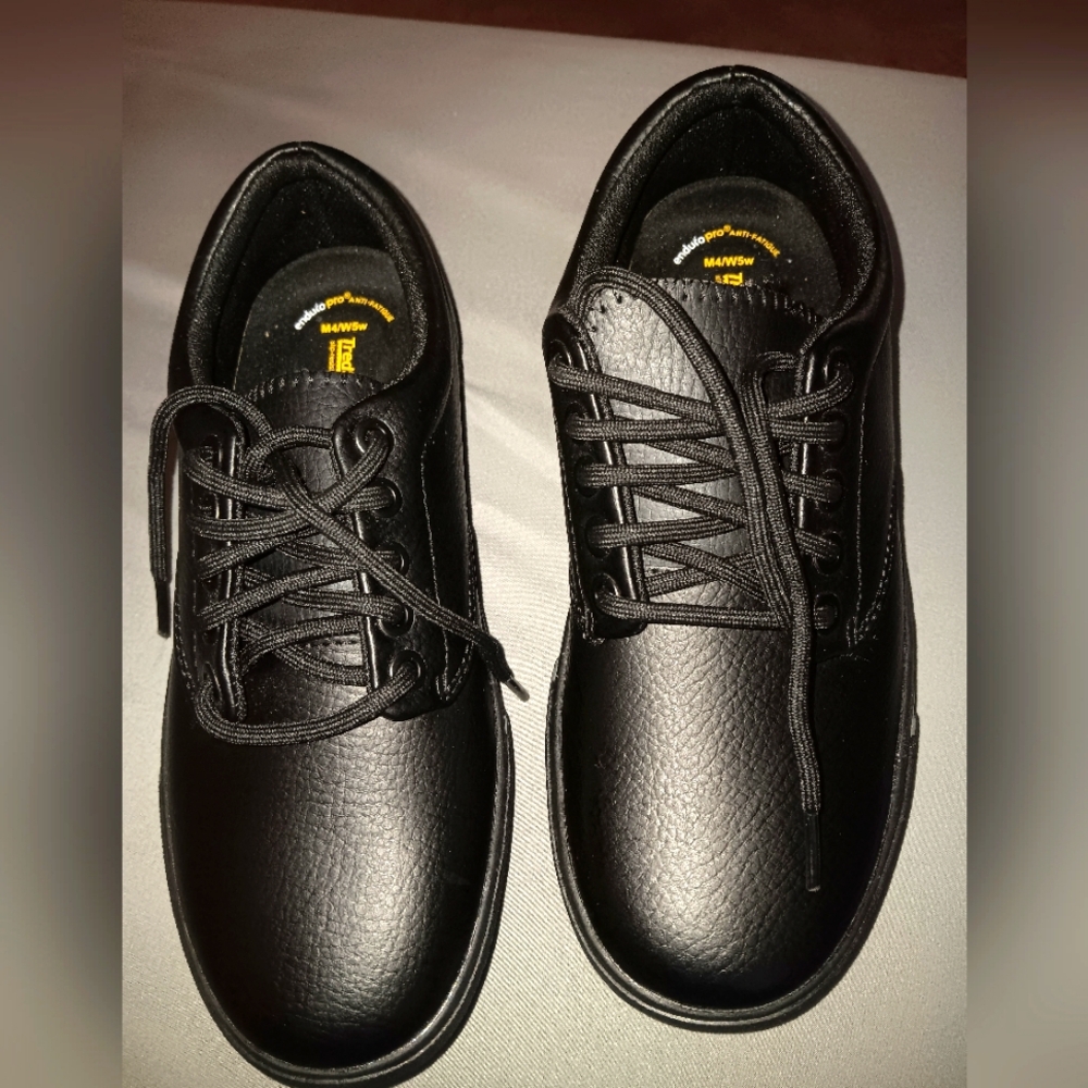 Boys size 4W/5W, TredSafe black dress shoe.